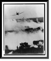 Two bombs tumble from a Vietnamese Air Force A-1E Skyraider over a burning Viet Cong hideout near Cantho, South Viet Nam, Vintage Wall Art