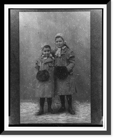 Anna and Sophie Freud, full-length portrait, standing, facing front, wearing coats and muffs.Dr. H. Heid, Wien, Vintage Print