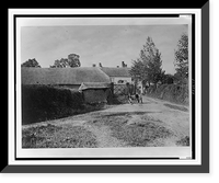 Rural scene (England?), men posed on farm equipment at entrance to farm complex, Vintage Print