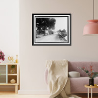 Historic Framed Print, [Unpaved road with several dilapidated wooden buildings, some moved off their foundation].Ewing, Inc., Baton Rouge, La.,  17-7/8" x 21-7/8"