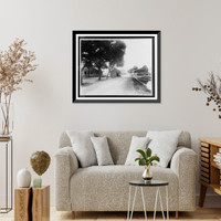 Historic Framed Print, [Unpaved road with several dilapidated wooden buildings, some moved off their foundation].Ewing, Inc., Baton Rouge, La.,  17-7/8" x 21-7/8"