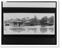 Flood waters up to the door of several houses.Ewing, Inc., Baton Rouge, Antique Print