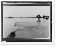Floodwater covering vast area submerging vegetation and damaged building.Ewing, Inc, Historic Print