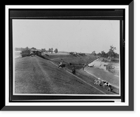 Chickens and cows grazing on side of levee, floodwaters in background and lower ground with buildings with minor damage, shack on crest, tents in background.Ewing, Inc, Vintage Print