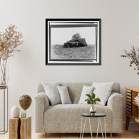 Historic Framed Print, [People standing on porch of collapsed house with fallen roof, cow and blocks of debris in foreground, some floodwater in background].Ewing, Inc.,  17-7/8" x 21-7/8"