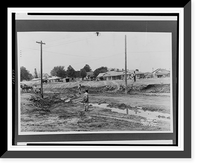 Historic Framed Print, [Man using mules to grade area destroyed by flood, homes and other buildings on higher ground in background].Ewing, Inc., Baton Rouge.,  17-7/8" x 21-7/8"