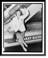 Historic Framed Print, [Miss America" Mary Ann Mobley,  full-length portrait,  waving,  seated on the base of an airplane gangway (stairs) after arrival at Idlewild airport,  New York,  New York]",  17-7/8" x 21-7/8"