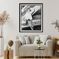 Historic Framed Print, [Miss America" Mary Ann Mobley,  full-length portrait,  waving,  seated on the base of an airplane gangway (stairs) after arrival at Idlewild airport,  New York,  New York]",  17-7/8" x 21-7/8"