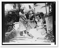 Barbara Hutton, seated (center), with two women on steps outside house, Historic Reproduction