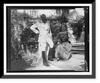 Barbara Hutton seated, with her husband Porfirio Rubirosa standing beside her, on steps outside house, Historic Reproduction