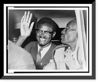 Patrice Lumumba, seated in car, waving as he leaves Idlewild airport, New York City, to attend a meeting with Dag Hammarskj&ouml;ld at the United Nations, Antique Print