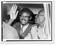 Patrice Lumumba, seated in car, waving as he leaves Idlewild airport, New York City, to attend a meeting with Dag Hammarskj&ouml;ld at the United Nations, Antique Print