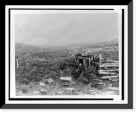 Unidentified old man, seated, writing, at entrance to a log and earth shelter in Alaska, 1899.Curtis, Antique Print