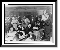 NAACP members at social gathering, Roy Wilkins standing on the right.photo by Cecil Layne, Historic Reproduction