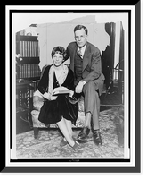 Historic Framed Print, [Amelia Earhart and husband George Palmer Putnam, full-length portrait, seated, facing front, in Mr. Putnam's New York office],  17-7/8" x 21-7/8"