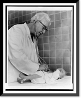 Historic Framed Print, Dr. Virginia Apgar welcoming world's newest guest.World Journal Tribune photo by Al Ravenna.,  17-7/8" x 21-7/8"
