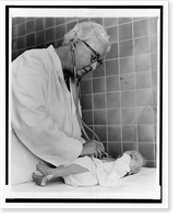 Historic Framed Print, Dr. Virginia Apgar welcoming world's newest guest.World Journal Tribune photo by Al Ravenna.,  17-7/8" x 21-7/8"