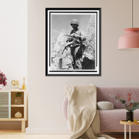 American soldier holding tattered Japanese flag, standing among rubble, probably in the Marshall Islands, Vintage Wall Art
