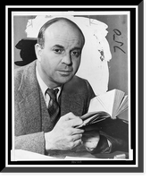 John Dos Passos, head-and-shoulders portrait, facing front, holding book.photo by Eric Schaal, Antique Print