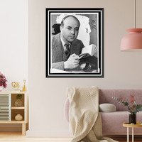 John Dos Passos, head-and-shoulders portrait, facing front, holding book.photo by Eric Schaal, Antique Print