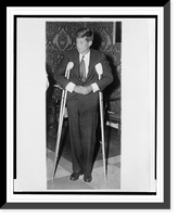 Historic Framed Print, [John F. Kennedy, full-length portrait, standing with crutches, facing slightly left],  17-7/8" x 21-7/8"