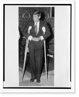 Historic Framed Print, [John F. Kennedy, full-length portrait, standing with crutches, facing slightly left],  17-7/8" x 21-7/8"