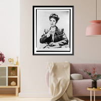 Historic Framed Print, [Clare Boothe Luce, half-length portrait, seated at desk, facing front, holding glasses in right hand],  17-7/8" x 21-7/8"