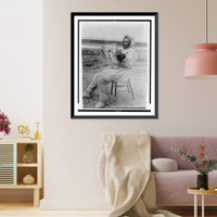 Historic Framed Print, Eskimo reading Saturday Evening Post in the arctic region,  17-7/8" x 21-7/8"