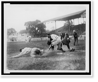 Historic Framed Print, [Umpire ready to make the call as Washington catcher reaches with ball in hand to make the tag on ball player sliding into home plate during baseball game],  17-7/8" x 21-7/8"