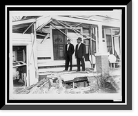 Historic Framed Print, [Reverend Ralph Abernathy (right) and Reverand W.J. Hudson, standing on the porch of Abernathy's home, view damage from bomb explosion January 10th 1957],  17-7/8" x 21-7/8"