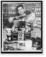 Historic Framed Print, Gus Marris is shown with a large display of Greek foods at the Couphopoulos Delicatessen at 306 W. 40th St..World Telegram & Sun photo by Fred Palumbo.,  17-7/8" x 21-7/8"