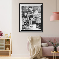 Historic Framed Print, Gus Marris is shown with a large display of Greek foods at the Couphopoulos Delicatessen at 306 W. 40th St..World Telegram & Sun photo by Fred Palumbo.,  17-7/8" x 21-7/8"