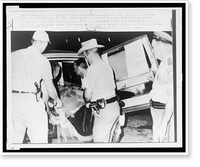 Historic Framed Print, Authorities remove one of three bodies from an ambulance at the University Medical Center,  17-7/8" x 21-7/8"