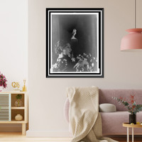 Historic Framed Print, [Judith Anderson, half-length portrait, reclining, clutching flowers, facing right],  17-7/8" x 21-7/8"