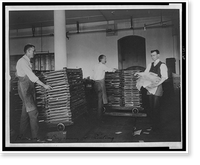 Historic Framed Print, [Workers moving newly printed currency into a drying box where sheets will dry before the next wetting and printing at the Bureau of Engraving & Printing],  17-7/8" x 21-7/8"