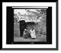 Historic Framed Print, [Two portraits of women seated in front of hut, shaking rattles, taken during visit by Alan Lomax and Mary Elizabeth Barnicle to Andros Island in the Bahamas],  17-7/8" x 21-7/8"