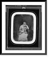 Historic Framed Print, [Unidentified girl, three-quarter length portrait, facing front, seated with elbow on large book on table],  17-7/8" x 21-7/8"