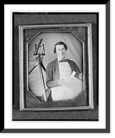 Historic Framed Print, [Occupational portrait of an unidentified surveyor with a transit on a tripod and holding dividers and a map, three-quarter length, seated],  17-7/8" x 21-7/8"