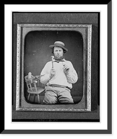 Historic Framed Print, [Occupational portrait of a carpenter, three-quarter length, seated, facing front, holding hammer and nail, on a chair at his side are a saw, box plane, and measuring device],  17-7/8" x 21-7/8"