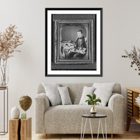 Historic Framed Print, [Occupational portrait of a salesman, three-quarter length, seated, displaying his wares],  17-7/8" x 21-7/8"