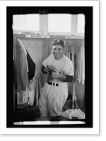 Historic Framed Print, [New York Yankee baseball player Yogi Berra, three-quarter length portrait, in uniform, in the locker room].Marvin E. Newman.,  17-7/8" x 21-7/8"