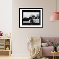 Historic Framed Print, [Danny Mantle holding a football; father Mickey Mantle is in background].Thomas R. Koeniges.,  17-7/8" x 21-7/8"