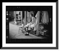 Historic Framed Print, [Mickey Mantle, New York Yankee baseball player, in locker room wrapping his leg prior to a game].Marvin E. Newman.,  17-7/8" x 21-7/8"