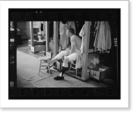 Historic Framed Print, [Mickey Mantle, New York Yankee baseball player, in locker room wrapping his leg prior to a game].Marvin E. Newman.,  17-7/8" x 21-7/8"