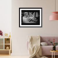 Historic Framed Print, [Mickey Mantle, New York Yankee baseball player, in locker room wrapping his leg prior to a game].Marvin E. Newman.,  17-7/8" x 21-7/8"
