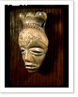 Historic Framed Print, [Mask-shaped ivory pendant worn by men who had undergone the tribal initiation rites, from the Bapende tribe, Belgian Congo],  17-7/8" x 21-7/8"
