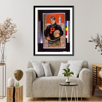 Historic Framed Print, [Princeton student, with letter P on sweater, half-length, standing, facing left, holding football(?), with Princeton University behind him].John E. Sheridan.,  17-7/8" x 21-7/8"