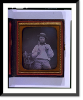 Occupational portrait of a carpenter, three-quarter length, seated, facing front, holding hammer and nail, on a chair at his side are a saw, box plane, and measuring device - 2 Timeless Wall Art