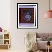 Occupational portrait of a carpenter, three-quarter length, seated, facing front, holding hammer and nail, on a chair at his side are a saw, box plane, and measuring device - 2 Timeless Wall Art