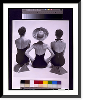 Back view of fashion models in swim suits, two kneeling wearing swim fins, and one seated, Vintage Print